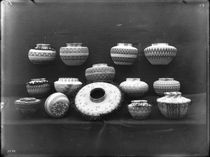 Collection of 14 Indian baskets on display, ca.1900