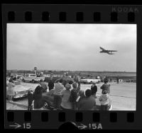 Crowd of people watching a 747 jumbo jet take off at Los Angeles International Airport, 1970