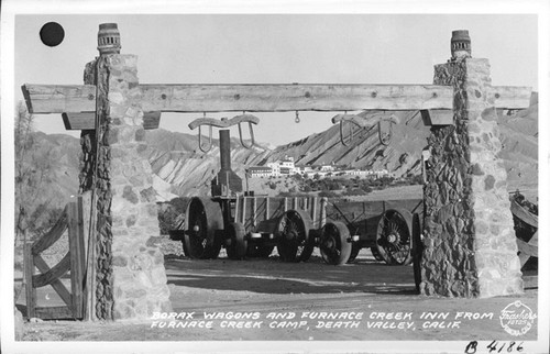 Borax Wagons and Furnace Creek Inn from Furnace Creek Camp, Death Valley, Calif