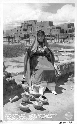 Santonita, Wife of Albert Lujan with Taos Pueblo Indian Pottery