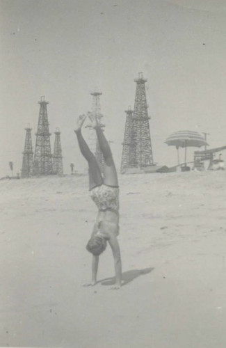 Annabelle Hennig McNeil doing handstand at Huntington Beach in 1943