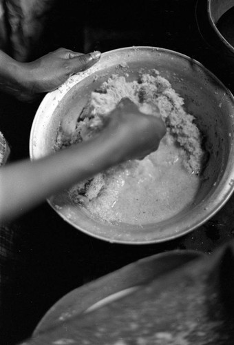 Woman preparing mashed coconut, San Basilio de Palenque, 1977