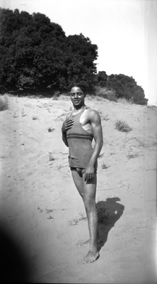 Young man in swim suit at the beach