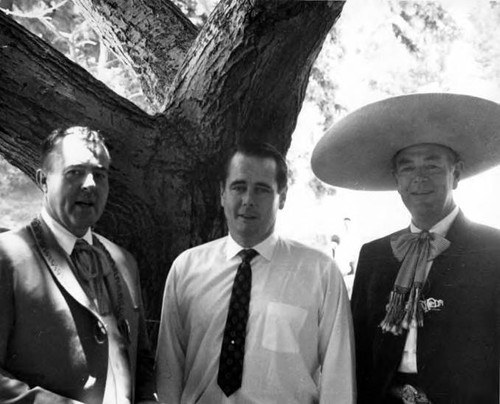 Owen Brady with John Bowles and another man by a tree