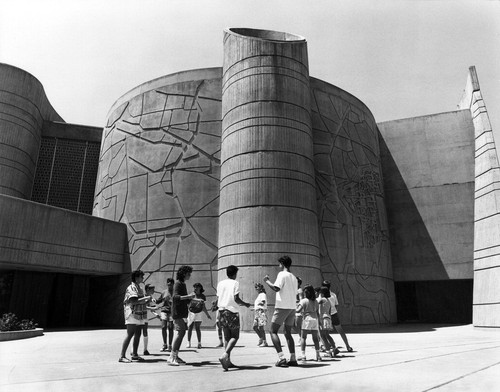 House of the Book with dancers in front