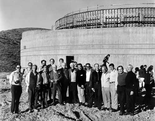 House of the Book under construction with board members posed in front