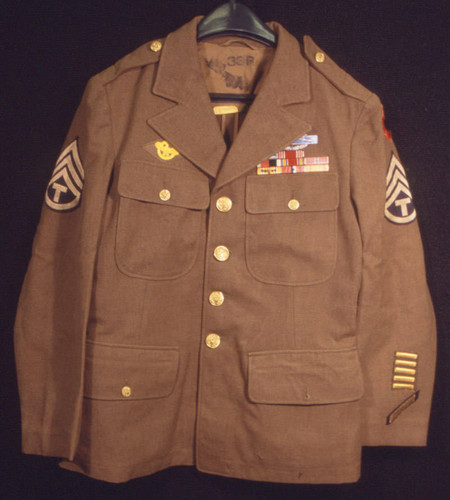 United States World War II military jacket decorated with medals and ribbons