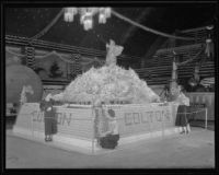 Three women help to construct the Colton's display at the National Orange Show, San Bernardino, 1934