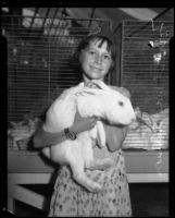 Forrest Mae Allison posing with her New Zealand rabbit at the LA County Fair, Pomona, 1934