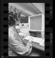 General Telephone Company operator using a computerized microfilm telephone directory in Los Angeles, Calif., 1973