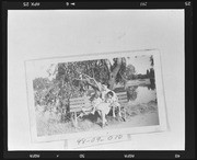 Roeding Park, mother, and two children on park bench