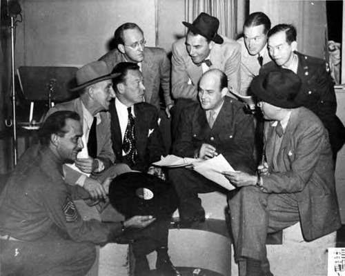Victor Quon with Jimmy Durante, Fred Allen, and Bob Hope. AFRS staff photo (on lower right corner)