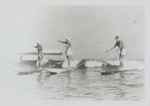 Shirley Templeman, Pat Collings, Fred Hunt surfing at Cowell Beach