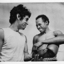 Jerry Jacobs, the manager of Sacramento featherweight Joe Guevara (left), aids him in preparing to box, at the Sacramento YMCA