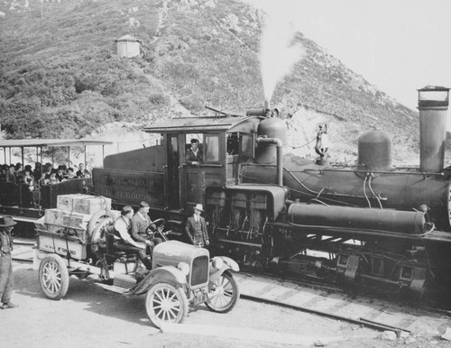 Chevy pickup truck along side locomotive number seven and train from the Mount Tamalpais and Muir Woods Railway at the summit of Mount Tamalpais