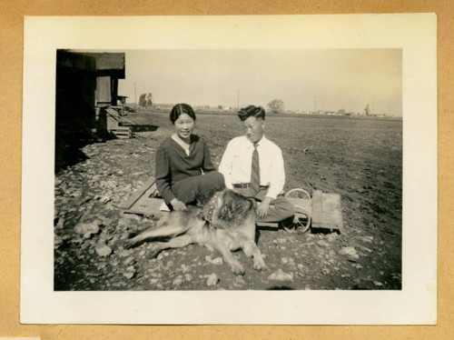 Mr. and Mrs. Yamasaki with a dog