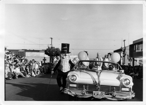 South San Francisco Bicentennial Parade - Mr. Peanut walking alongside parade car (1958)