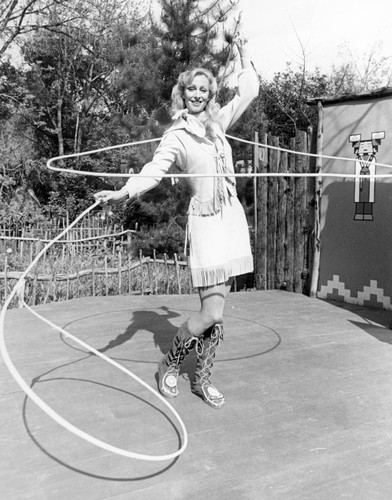 Woman performing lasso trick at Frontier Village — Calisphere