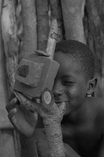 Boy playing with a toy camera, San Basilio de Palenque, 1977