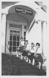 Camp Fire Girls bringing Easter baskets to Petaluma General Hospital, Petaluma, California