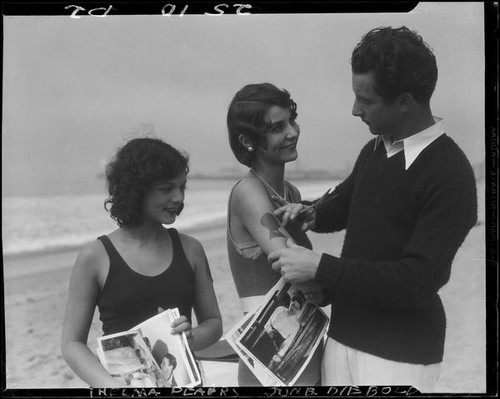 Silhouette artist Georges Boria and sunbathers Thelma Peairs and June Diebold, Venice, 1930