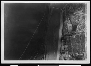 Aerial view of flooding near what appears to be an airport, 1938