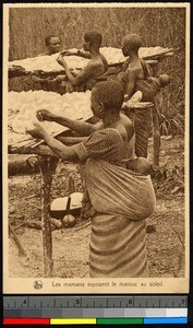 Women preparing cassava with infants on their backs, Congo, ca.1920-1940