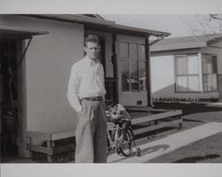 Andrew Wanko and his son Andrew Wanko, Jr. stand in front of their home in Petaluma, California, 1958