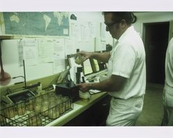 Rich Bolman working in the lab at the California Cooperative Creamery on Western Avenue, Petaluma, California, 1984