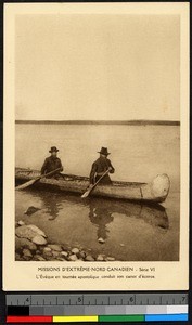Two missionary fathers paddling a canoe, Canada, ca.1920-1940