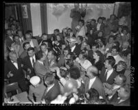 People swarming Vice-President Elect Richard M. Nixon at Republican headquarters after winning in the presidential election, Calif., 1952