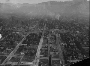 An aerial view of Pasadena, looking north along Fair Oaks Avenue and Raymond Avenue, ca. 1900-1940