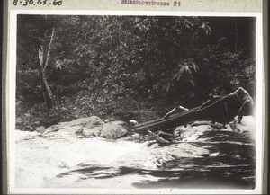 A rowing boat being pulled up the rapids (1925)