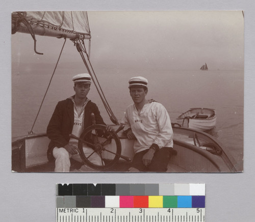 Roland and Edwin Oliver in sailor suits, at helm of yacht. [photographic print]