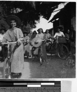 Native Sisters on bicycles, Kaying, China, ca. 1940
