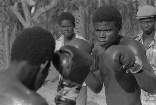 Boxers fighting inside ring, San Basilio de Palenque, ca. 1978