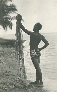 A Tahitian fisherman with a net