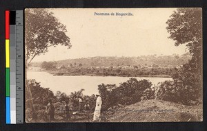 Missionary father on hillside overlooking body of water, Cote d'Ivoire, ca.1920-1940