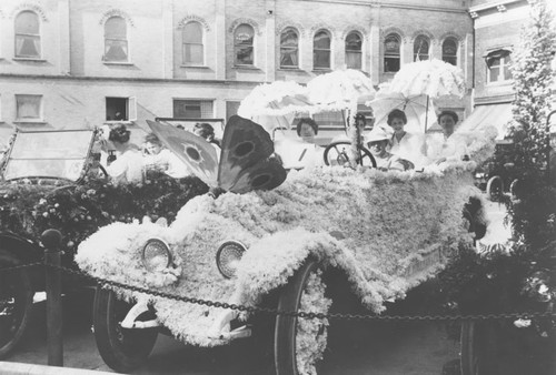 Woman's Club of Orange Flower Show Parade automobile covered with flowers, 1917