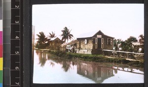 Houses and canal, Guyana, ca. 1934