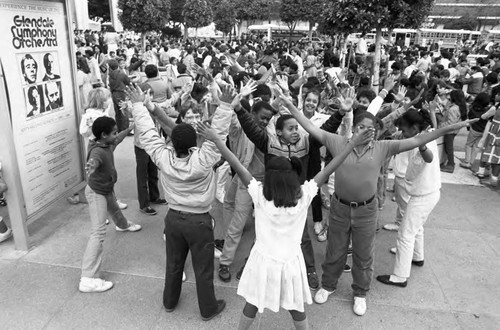 Good Shepard Lutheran School children practicing a dance routine outside, Los Angeles, 1986