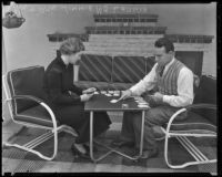 Boxer Jimmy McLarnin and his wife, Lillian, play cards, Beverly Hills, 1936