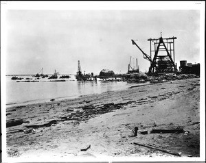 Shore at San Pedro during the removal of Deadman's (Rattlesnake) Island and the construction of the breakwater, Los Angeles, ca.1929