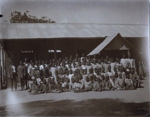 Pupils and their teachers in front of their school, Lealui