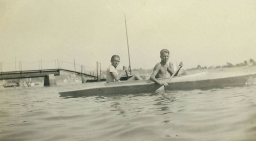 Ward Payne and friend canoeing at Balboa Pier, Newport Beach
