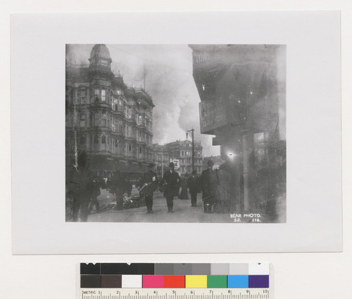 [Street scene with fire burning in distance. Unidentified location. No. 116.]
