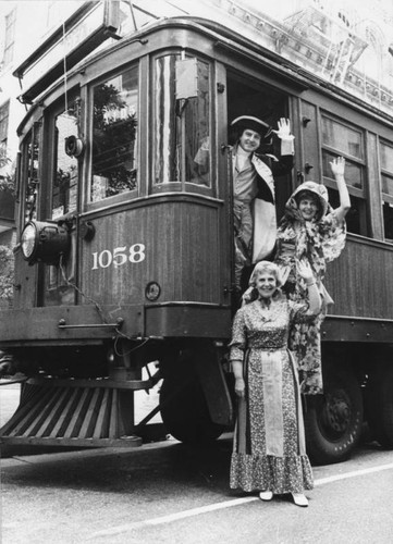 Three persons on old Pacific Electric Red Car