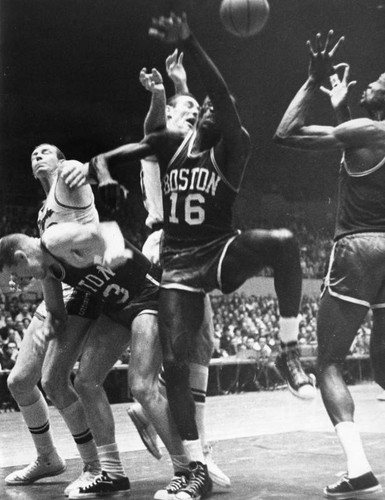 A writhing batch of Celts and Lakers battle for ball