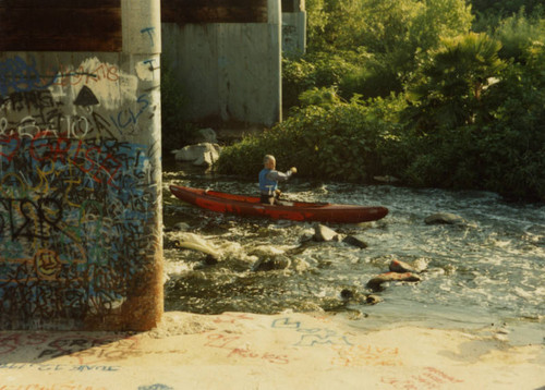 Man canoeing on the Los Angeles River
