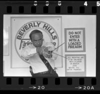 Arthur Kassel demonstrates use of a taser (stun gun) at Beverly Hills Gun Club, Calif., 1985